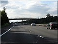 SP3556 : M40 motorway - Kingston Grange footbridge by Peter Whatley