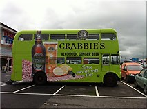 NH6945 : 'Crabbies' advertising bus at Tesco, Inverness by Dave Fergusson