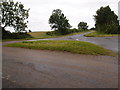 Grass covered road junction near Hargrave