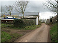 Farm buildings and a yacht near Downton Cross