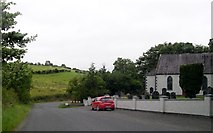 H5906 : Bend in the Cootehill Road by the Kilmount Presbyterian Church by Eric Jones