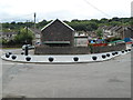 Solid black spheres line a bend in the road, Newbridge