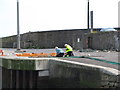 Fishermen repairing their nets at Kilkeel Harbour