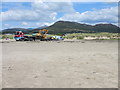 Unloading the excavator on Morfa Bychan beach