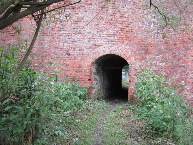 The path goes under the rail bridge
