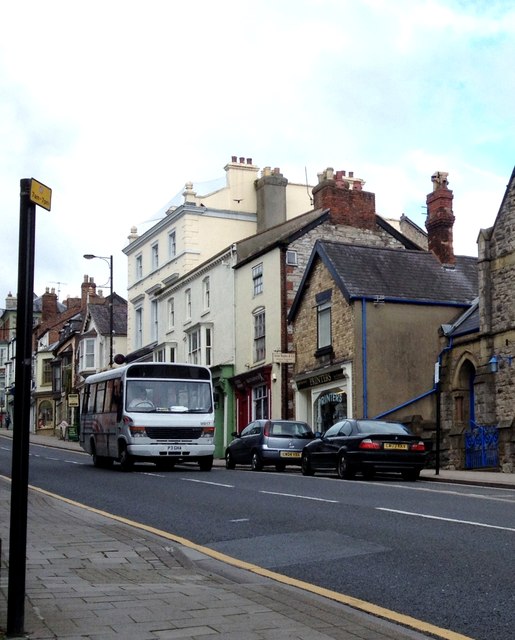 A small bus travels down Vale Street, Denbigh