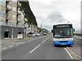 Ulsterbus coach waiting for passengers, Downhill