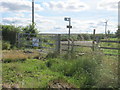 Stile and finger post for footpath to Haswell