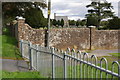 Wall separating cemetery from cricket ground, Weymouth Avenue