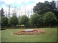 Flower bed and bench seat in War Memorial garden