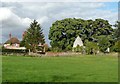TL2427 : Manor Farm and St Etheldredas Church by Humphrey Bolton