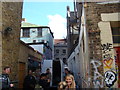 View back out onto Brick Lane from the alleyway