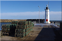 NO5603 : Anstruther lighthouse and lobster creels by Ian Taylor