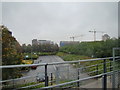 View of the Thames Barrier Park car park from the path through the park