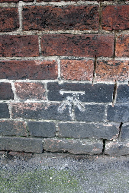 Benchmark on wall of Wollaton Road