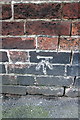 Benchmark on wall of Wollaton Road