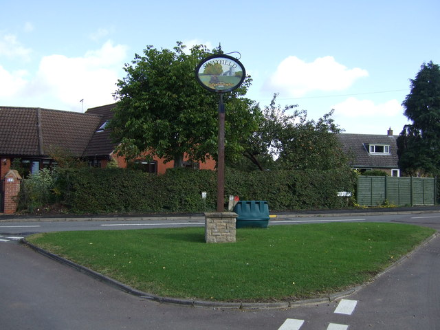 Village green and sign, Swayfield