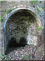 NY7752 : The right hand arch and draw holes of Ouston lime kiln by Mike Quinn