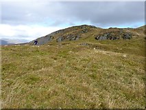 NN7032 : Craggy outcrops on the western side of Creag Uchdag by Richard Law