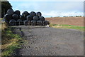 ST4798 : Silage bales in a field by Philip Halling
