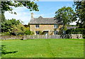 Green and cottage at Wyck Rissington