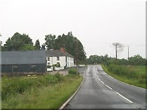 H1355 : Farmhouse and buildings on the A46 at Drumcrow East by Eric Jones