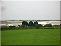 SN3707 : View across the fields to Carmarthen Bay Holiday Centre by Simon Mortimer