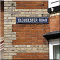 SX8670 : Gloucester Road brickwork and street nameplate by Robin Stott