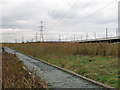 TQ5479 : Broadwalk, Pylons, Rail & Road by Roger Jones