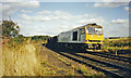 Site of Appleby (Lincs.) station, with Up freight train, 1993