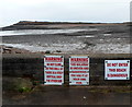 Warning notices at the edge of Swanbridge beach