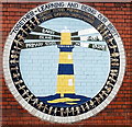 Badge painted on the wall of  Barry Island Primary School and Nursery