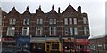 SX9293 : Ornate facades of shops in Sidwell Street, Exeter by David Smith