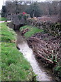 Roadside brook runs past the Old Forge