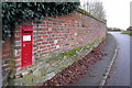 Postbox in a wall by Radclive main street