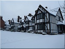 SP9211 : Louisa Cottages in the snow by Rob Farrow