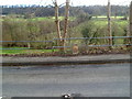 Rusty milepost at railings on Slad Road, Stroud