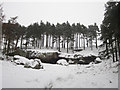 NU0535 : St Cuthbert's Cave in the snow by Graham Robson