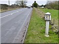 Milepost beside the A523