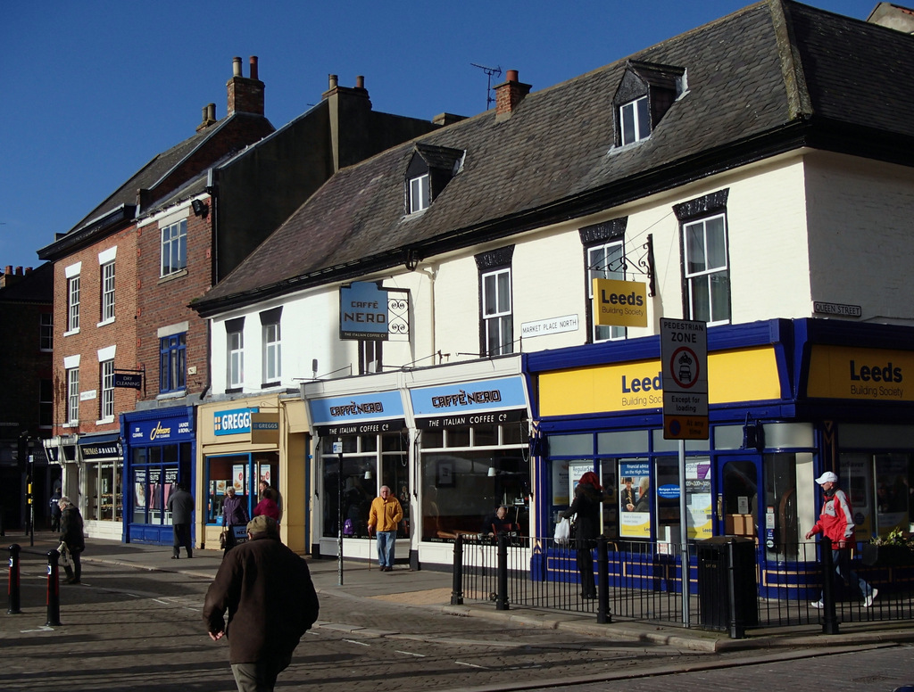 Shops at the north side of Ripon market... © Andrew Hill ccbysa/2.0