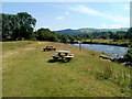 Picnic benches near an Afon Sawdde weir