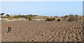 A rain gauge in a ploughed field off Moor Road