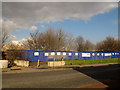 Blue hoarding on Woolwich Road