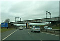 NT1071 : M8 westbound, passing under railway bridge by Peter Bond