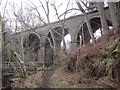 NY6752 : Viaduct (disused) and Footbridge over Knar Burn by Les Hull
