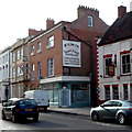 An old sign on a High Street wall, Bridgwater