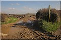 SX6957 : Muddy field entrance, Cannamore by Derek Harper