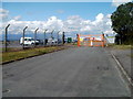 Orange entrance gate to Rhoose airport fire and rescue station