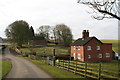 Farm cottages and a footpath, opposite Manor Farm