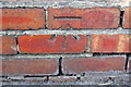 Benchmark on wall fronting #30 Toronto Road